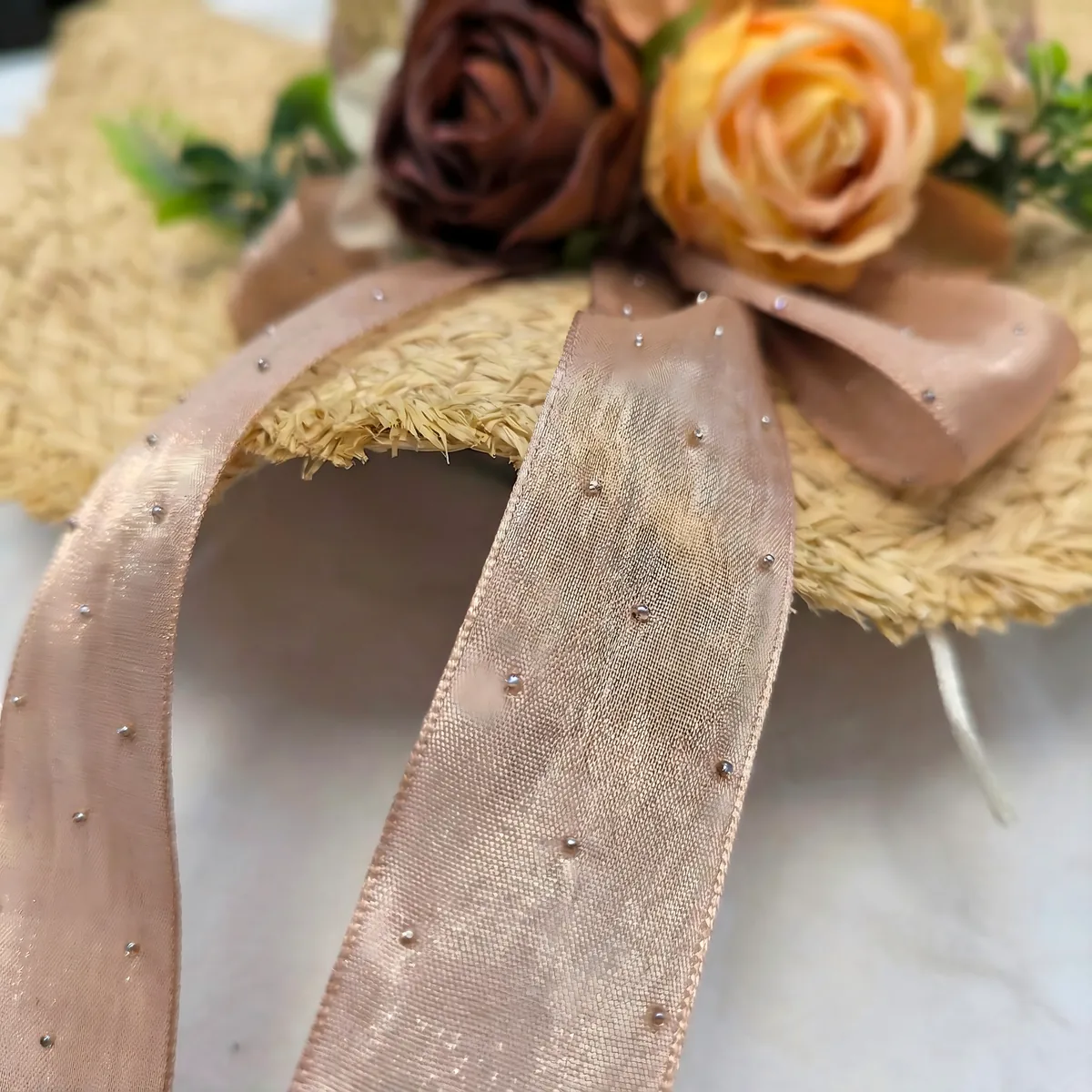 Floral Raffia Sun Hat 60 Floral Raffia Sun Hat 60 made with natural raffia and woven straw for summer resort collections