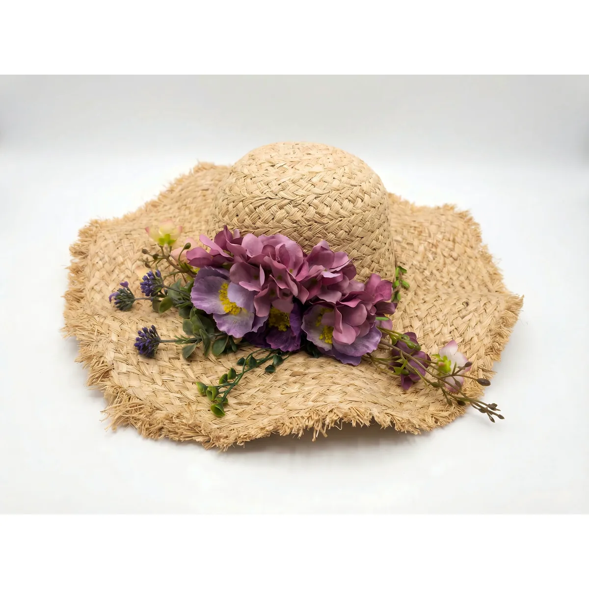 Floral Raffia Sun Hat 92 Floral Raffia Sun Hat 92 made with natural raffia and woven straw for summer resort collections